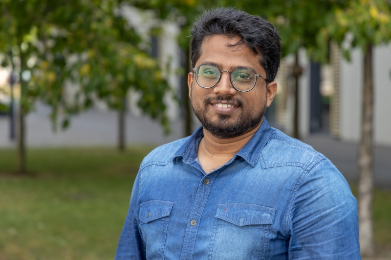 Saswat Patra standing in front of trees